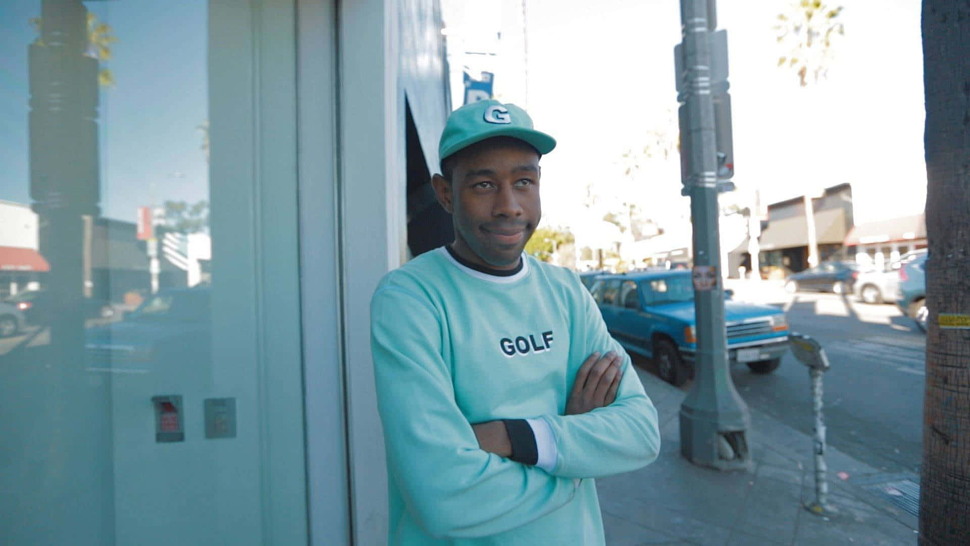 Tyler The Creator At Desk Background