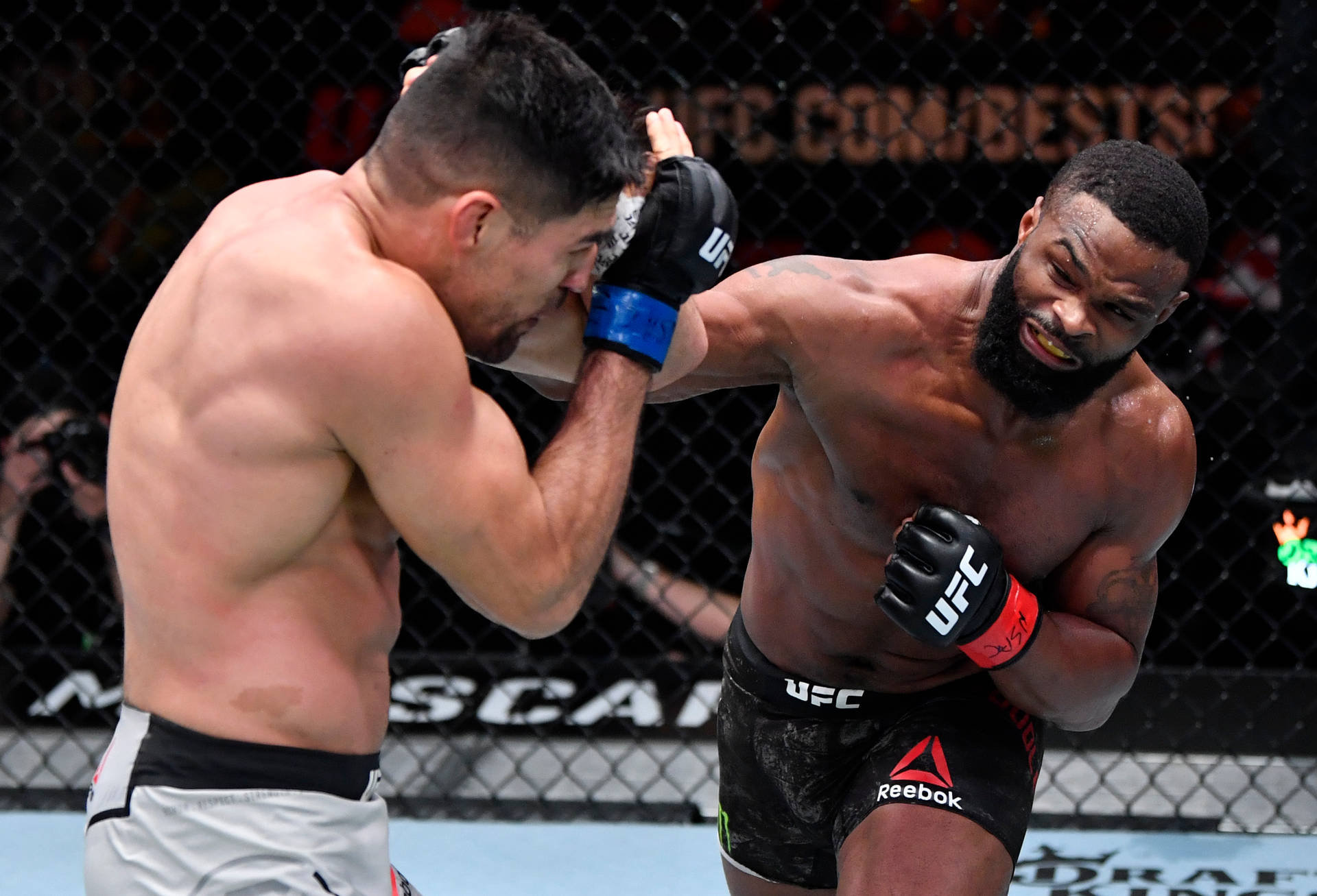Tyron Woodley Aggressive Overhand Background