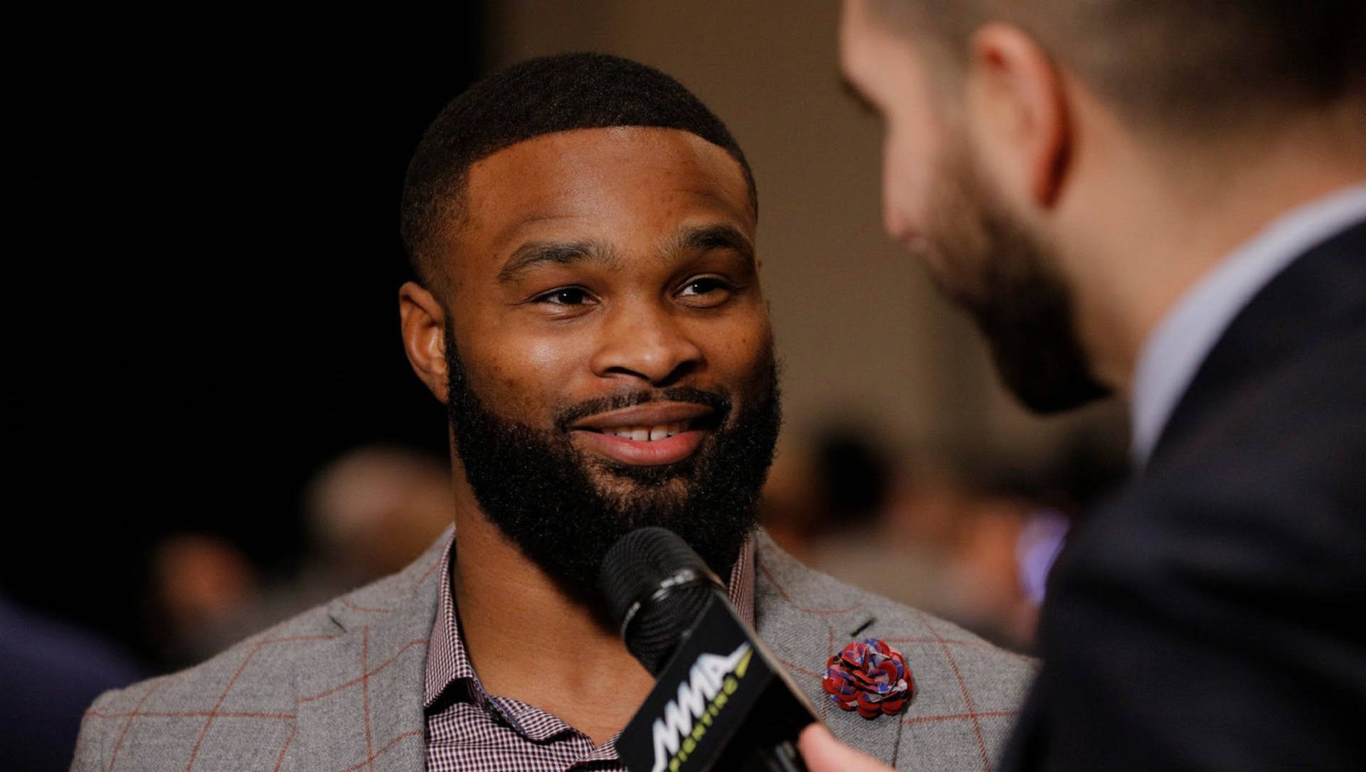 Tyron Woodley In Light Grey Suit Background