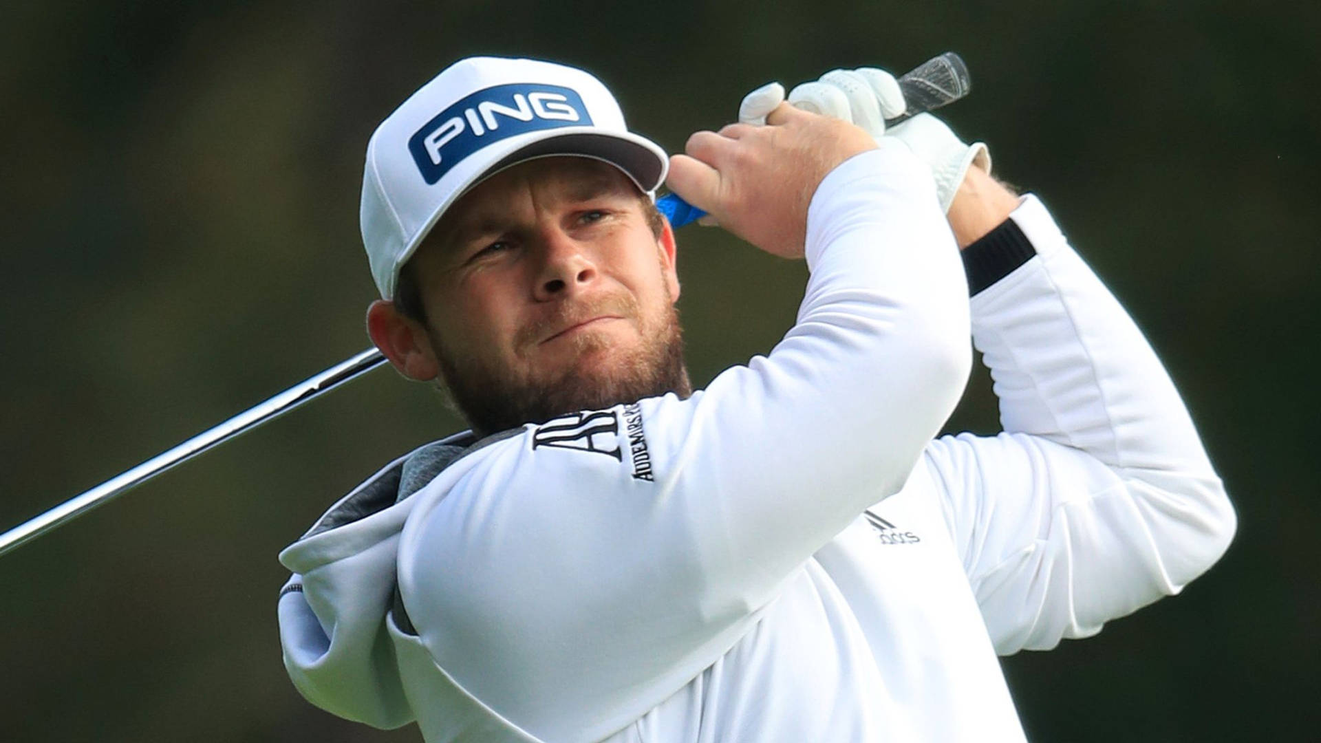 Tyrrell Hatton In Action At A Golf Tournament Background