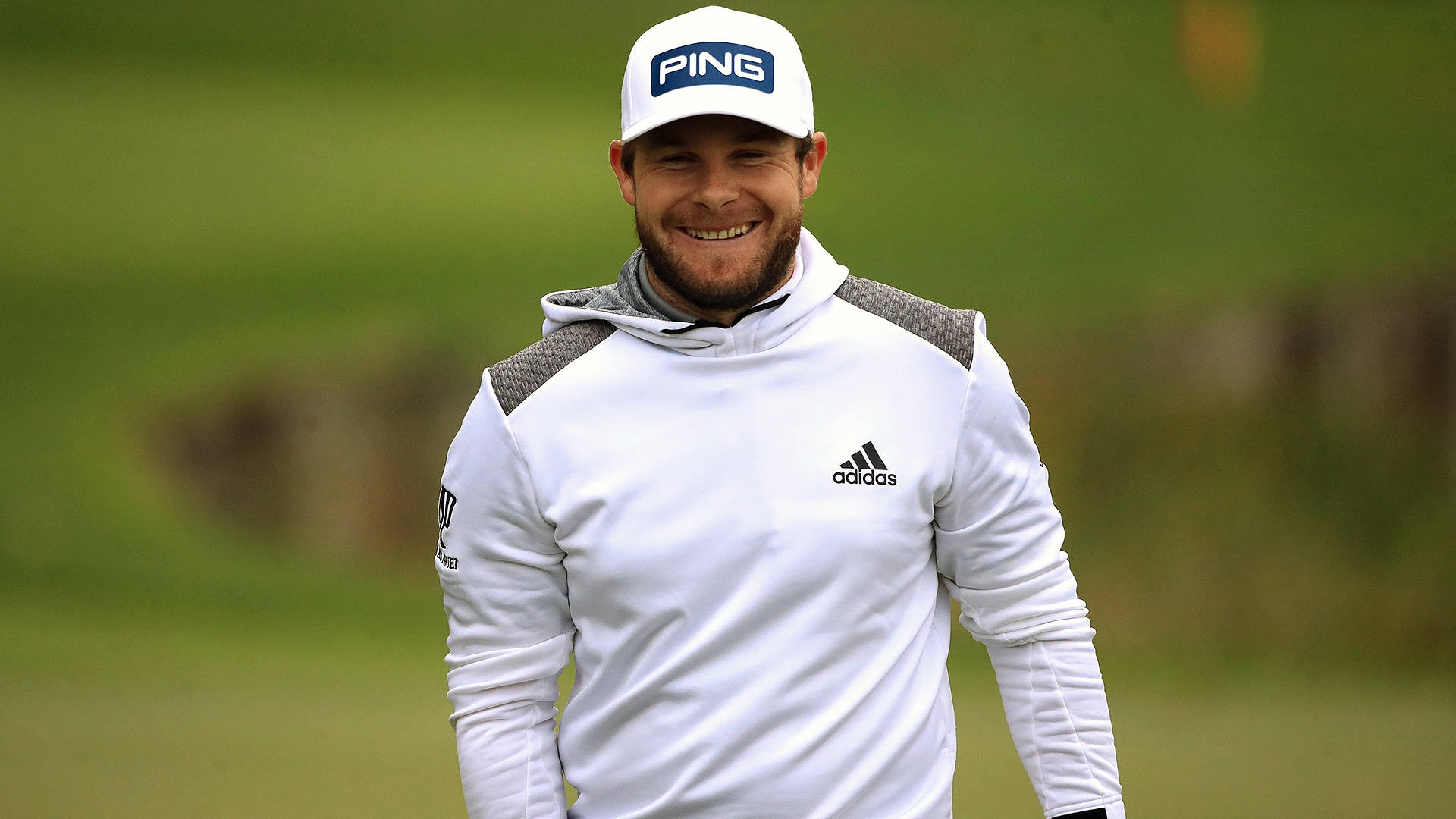 Tyrrell Hatton In Action On The Golf Course Background