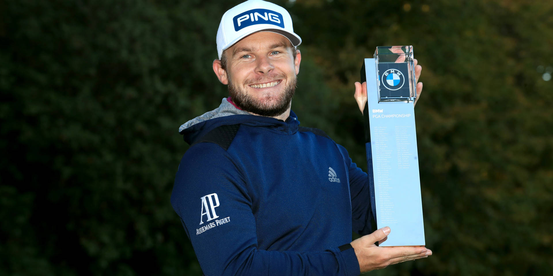 Tyrrell Hatton Swinging With Confidence At A Golf Tournament Background