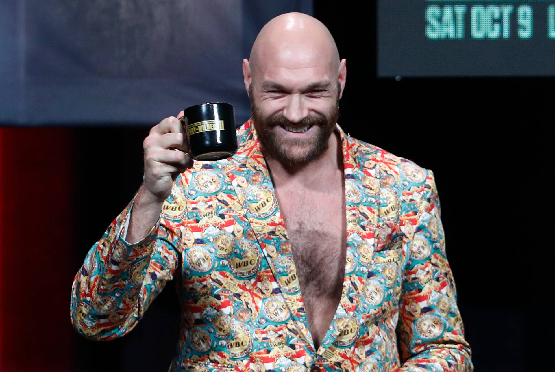 Tyson Fury Cheers Using Cup Of Coffee Background