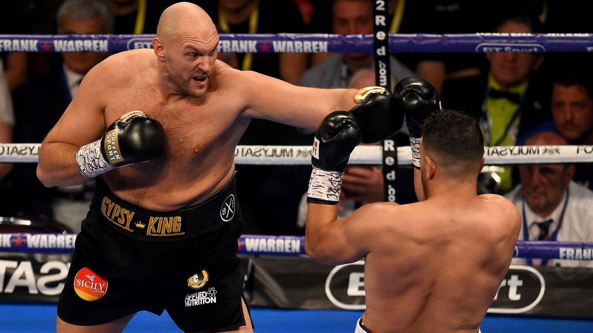Tyson Fury Throwing His Mighty Punch Background