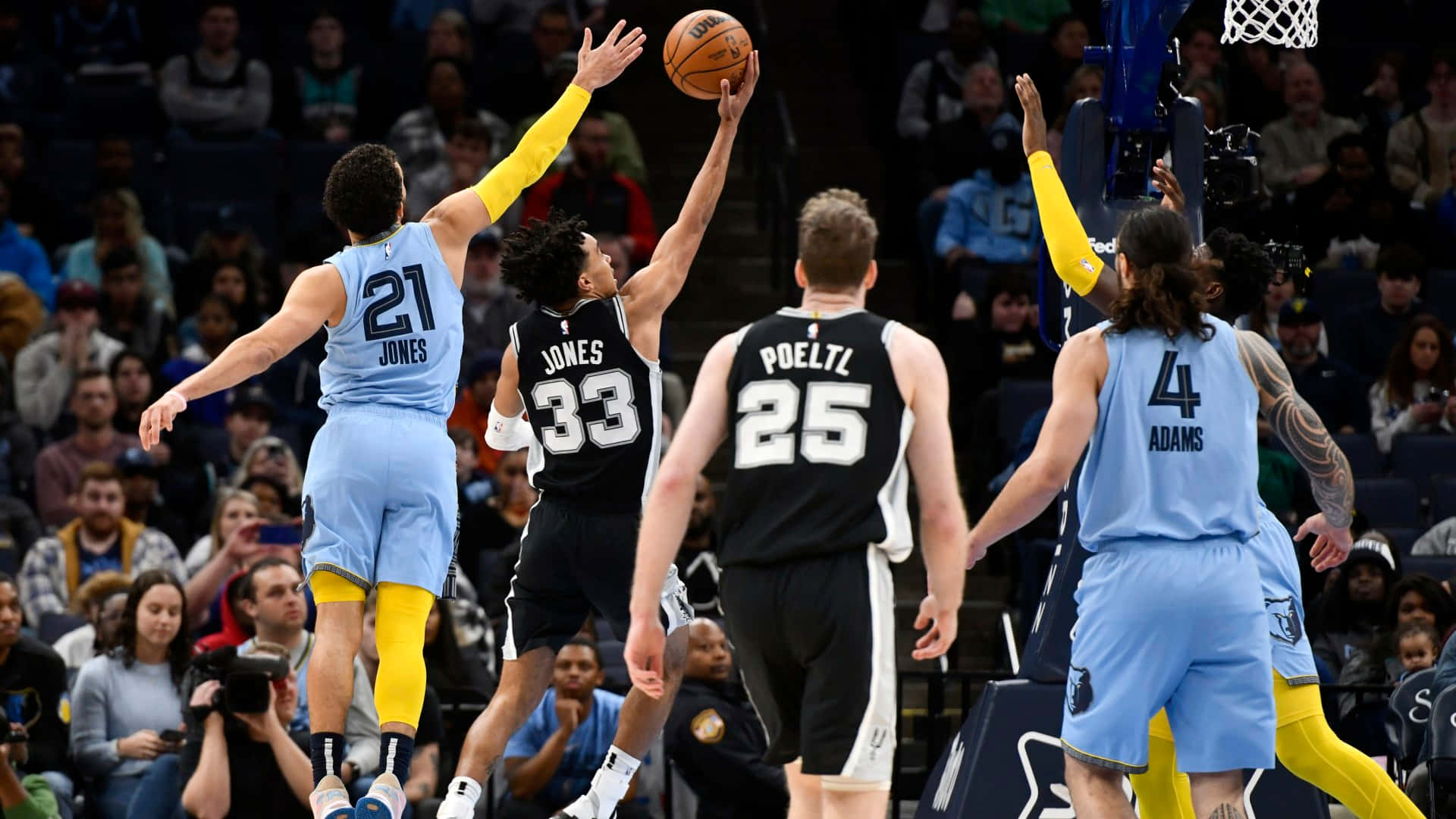 Tyus Jones Basketball Athlete Number 33 Background