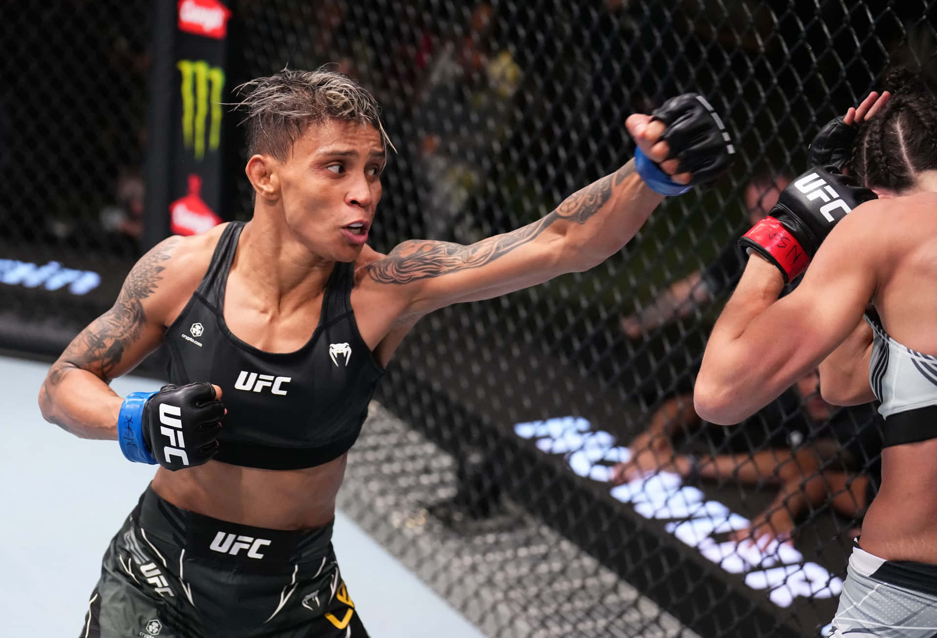 U F C Fighter Amanda Lemosin Action Background