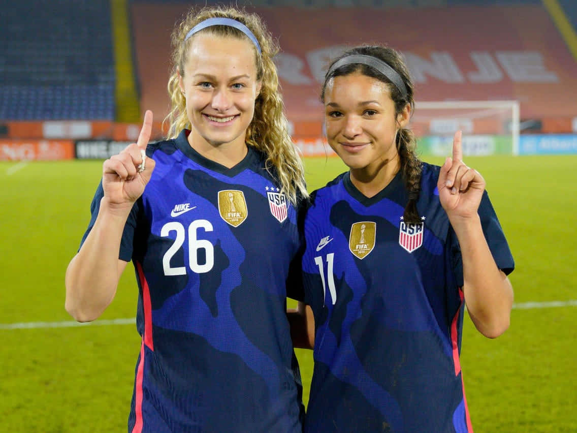 U S A Soccer Players Celebrating Victory Background