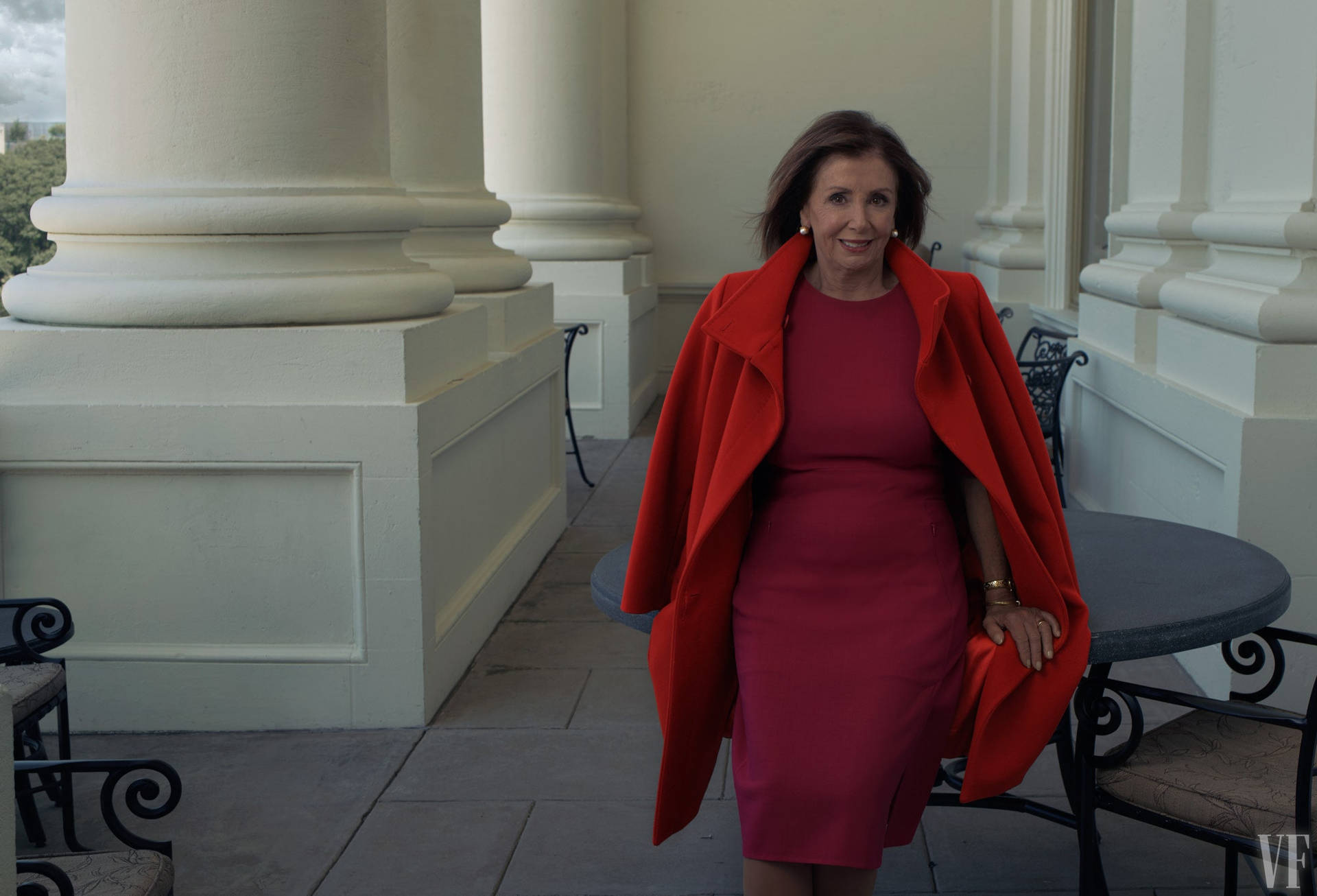 U.s. House Speaker Nancy Pelosi Wearing A Vibrant Red Ensemble Background