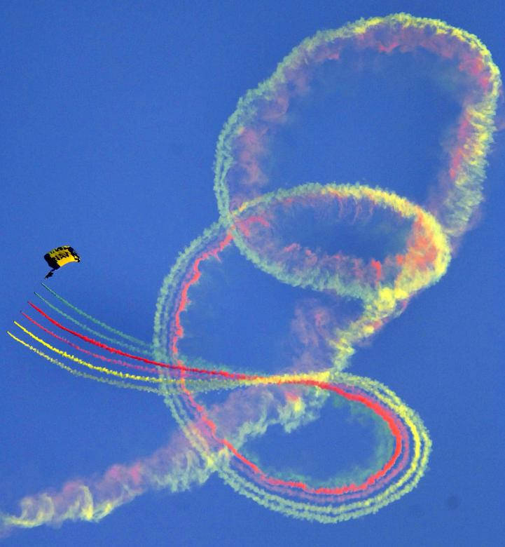 U S Navy Blue Angels Parachuter Making Spirals Background