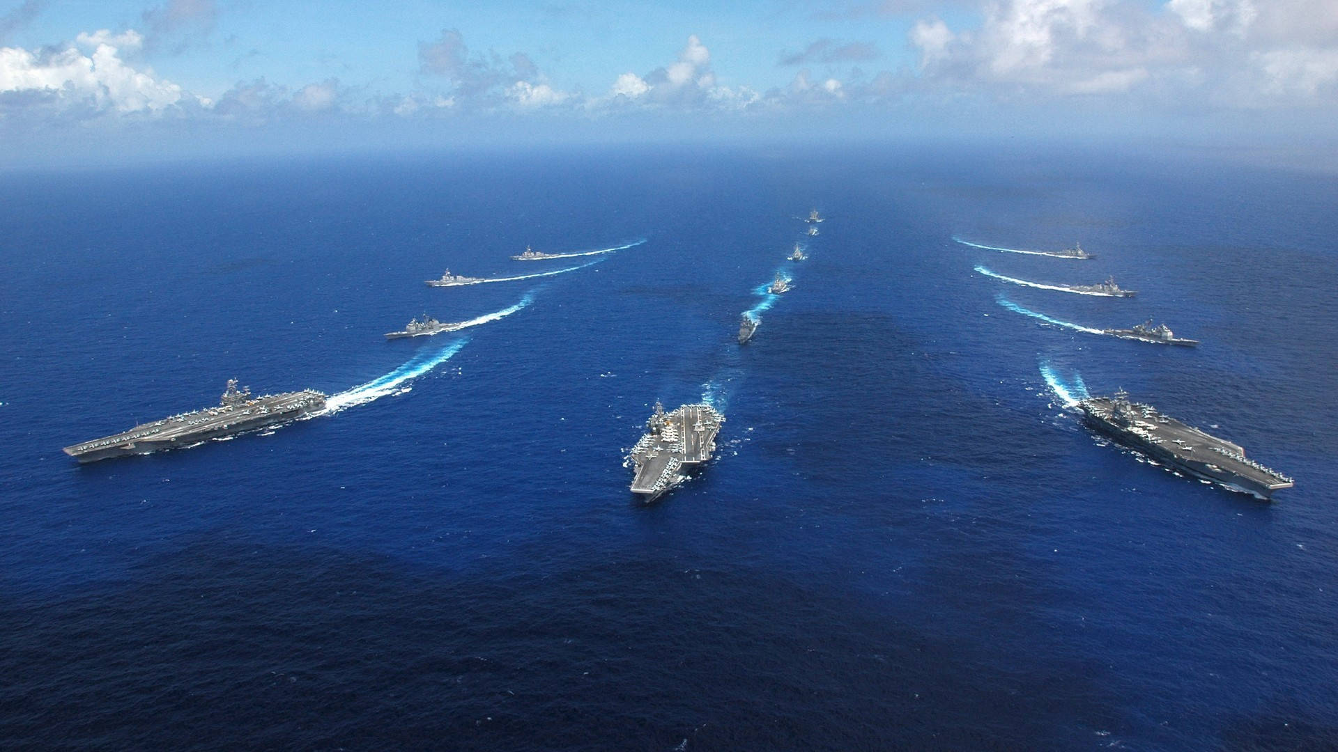 U S Navy Carriers Sailing In Formation Background