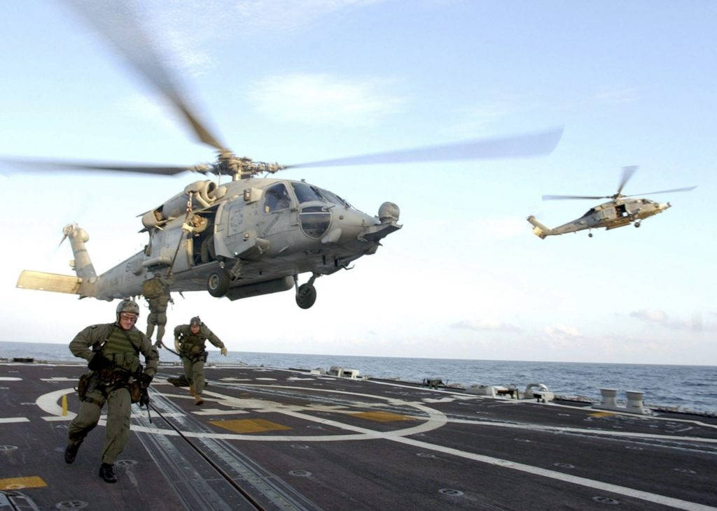 U S Navy Helicopter Landing On A Carrier