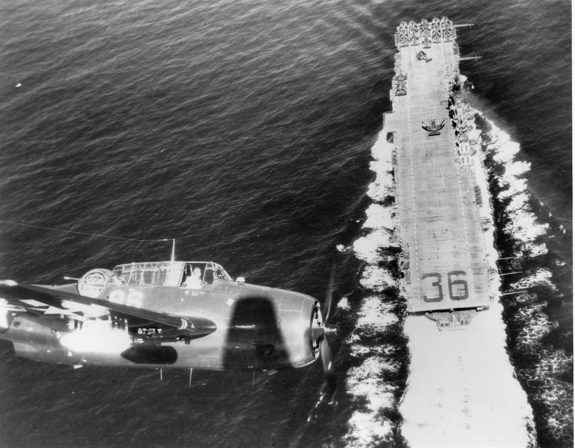 U S Navy Plane Flying Above A Carrier