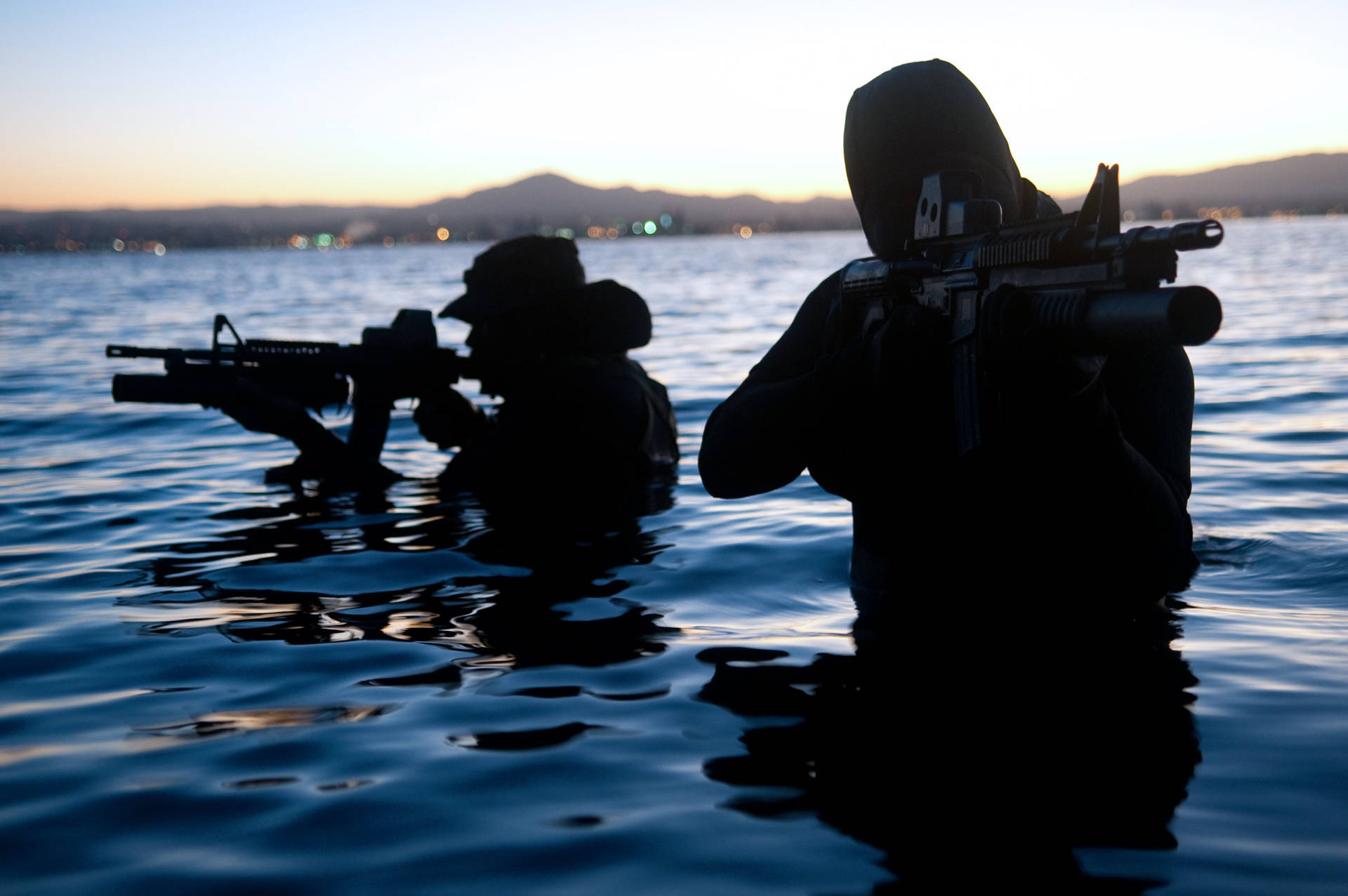 U S Navy Seals Partially Submerged In Water Background