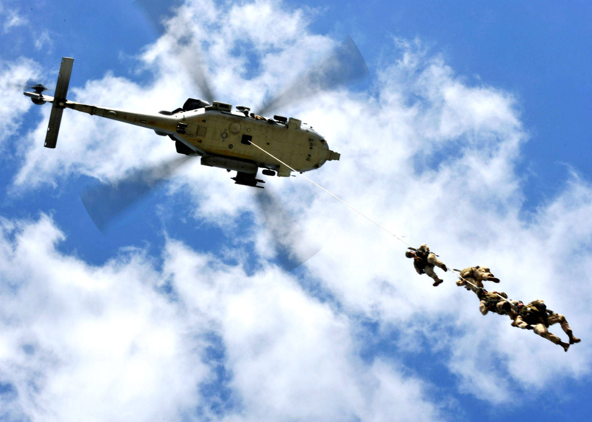 U S Navy Soldiers Dropping Off A Helicopter Background