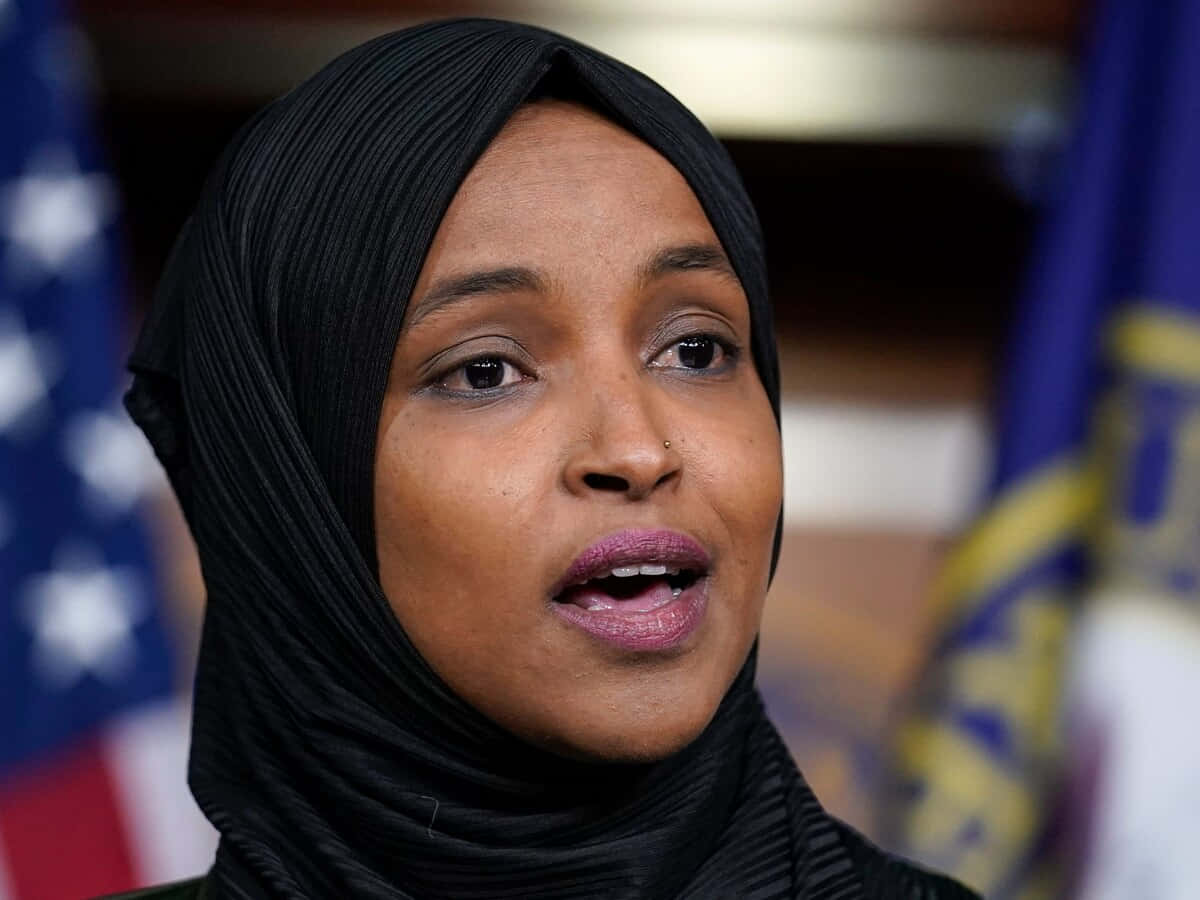 U.s. Representative Ilhan Omar Speaking Passionately Background