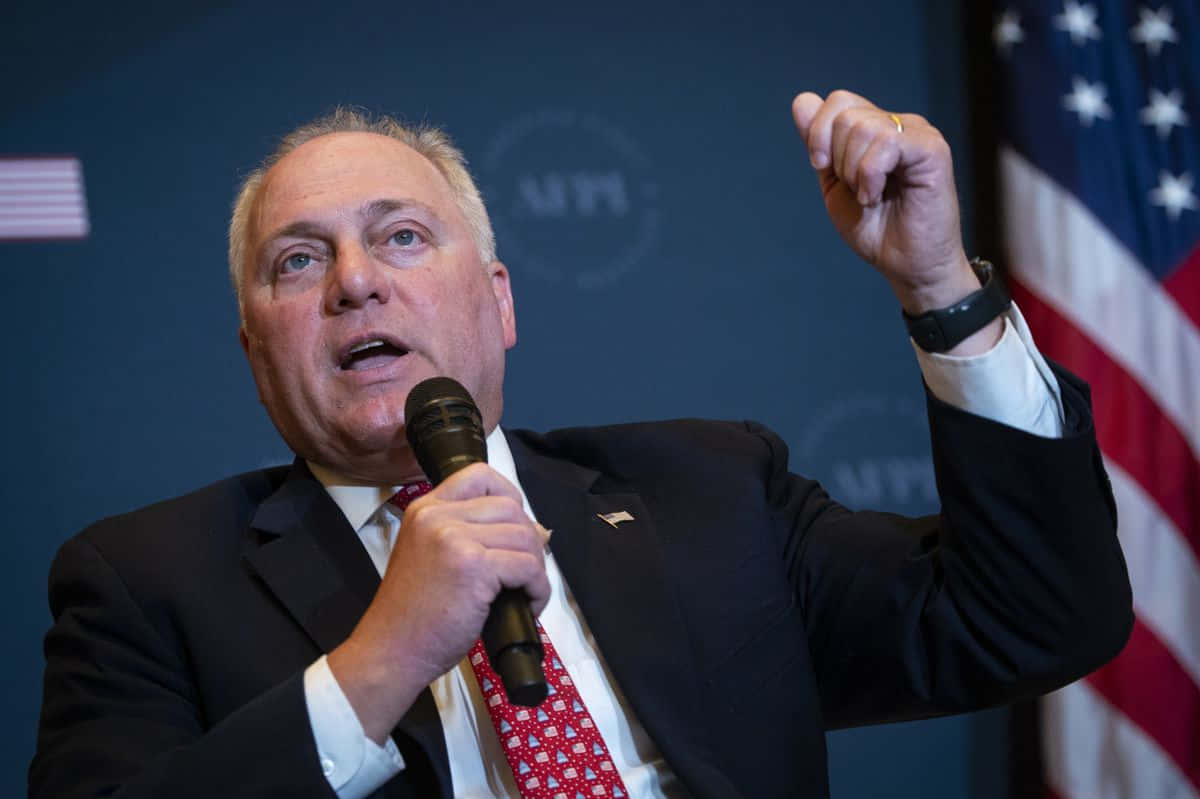 U.s. Representative Steve Scalise Raising His Fist In A Determined Stance Background