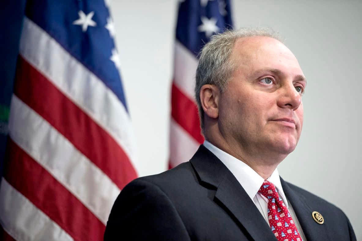U.s. Representative Steve Scalise With American Flags In The Background Background