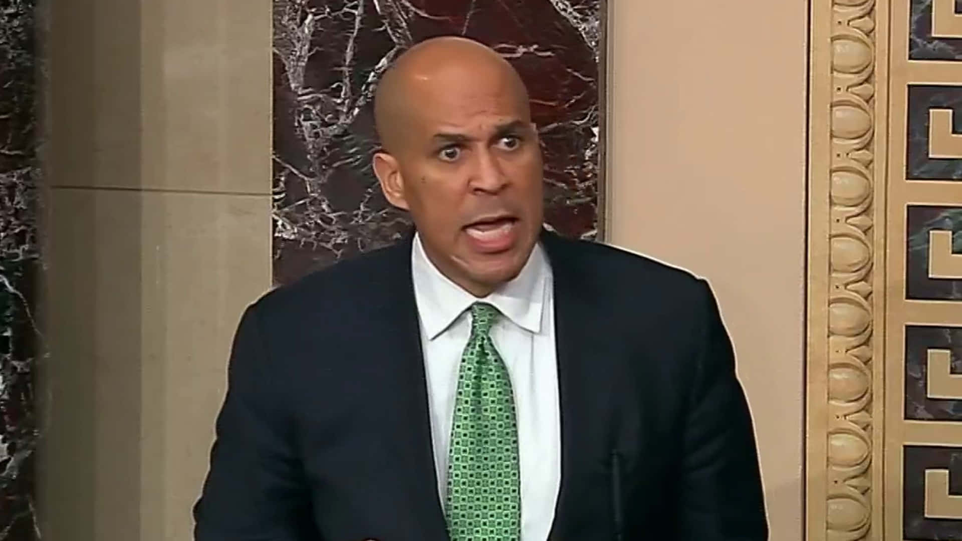 U.s Senator Cory Booker In Green Tie Background