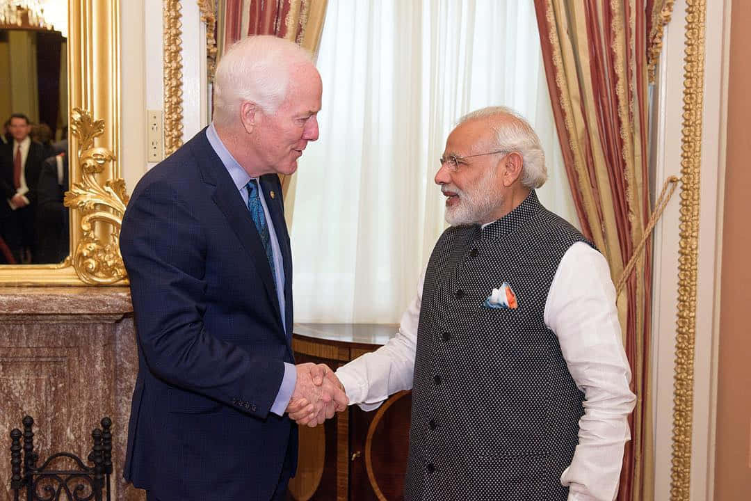 U.s. Senator John Cornyn Shaking Hands With Constituent