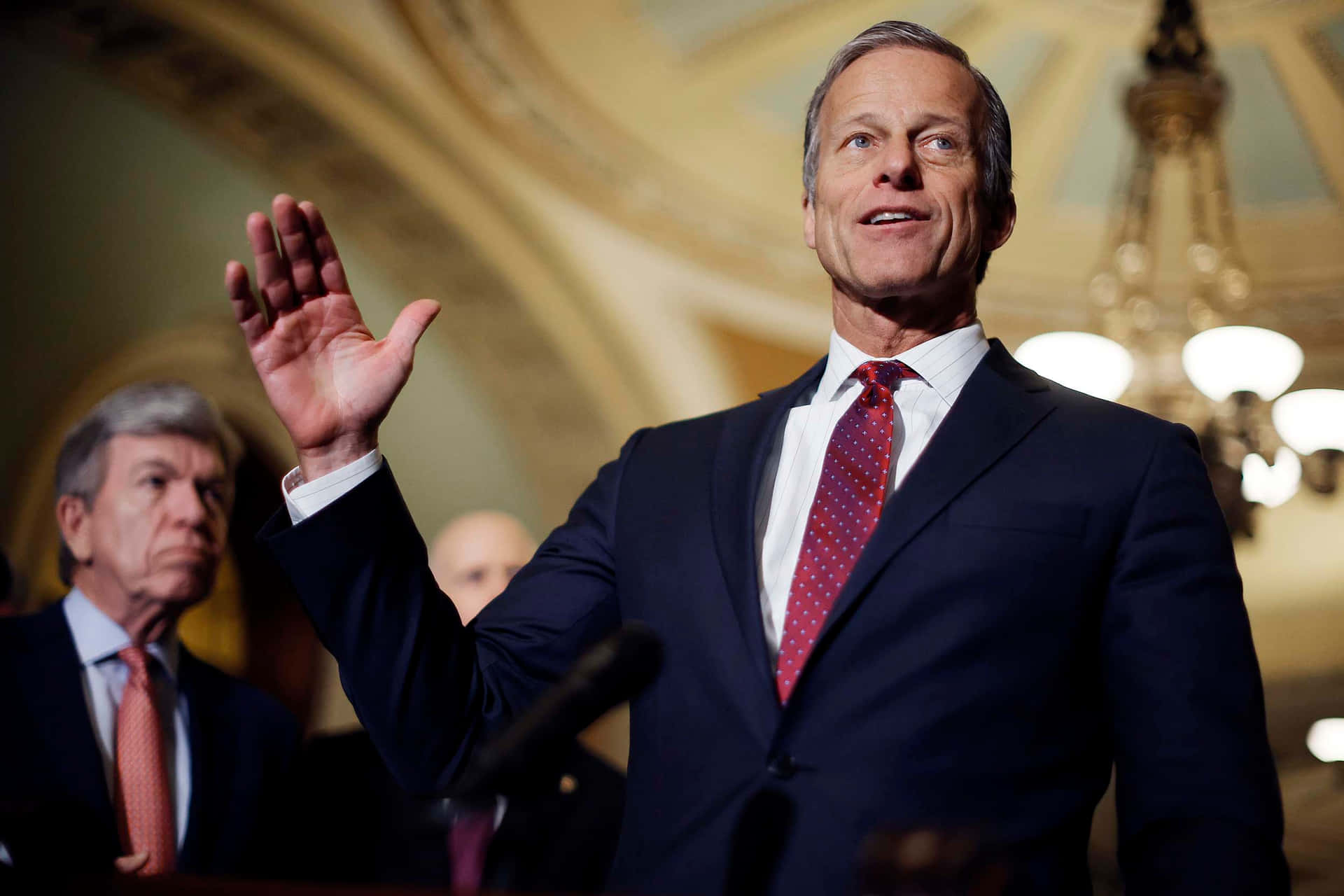 U.s Senator John Thune Raising His Hand Background