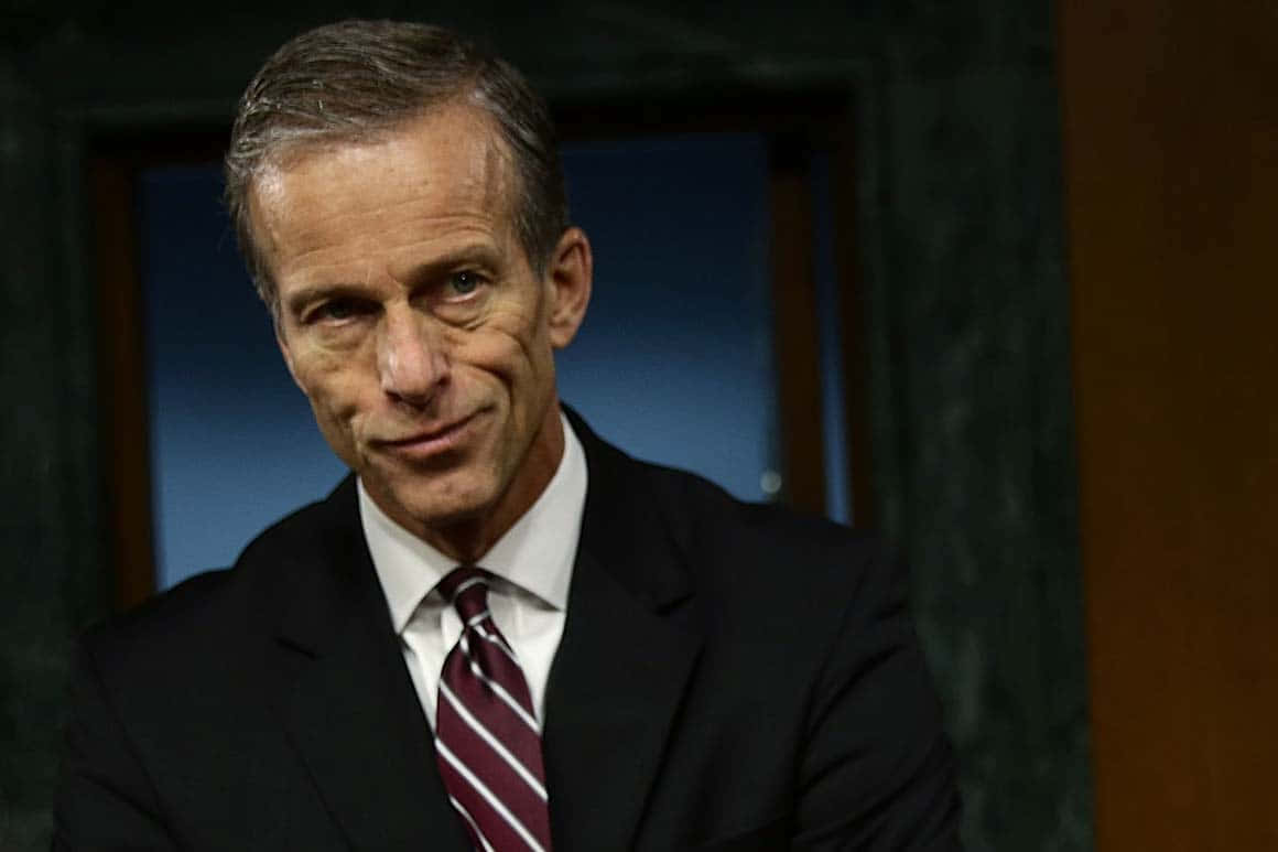 U.s Senator John Thune With A Smirking Expression Background