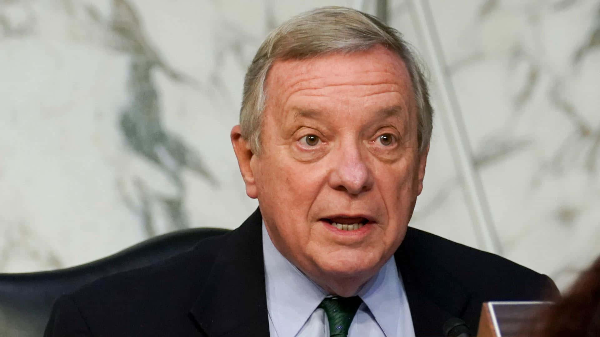 U.s. Senator Richard Durbin In A Green Business Tie Background