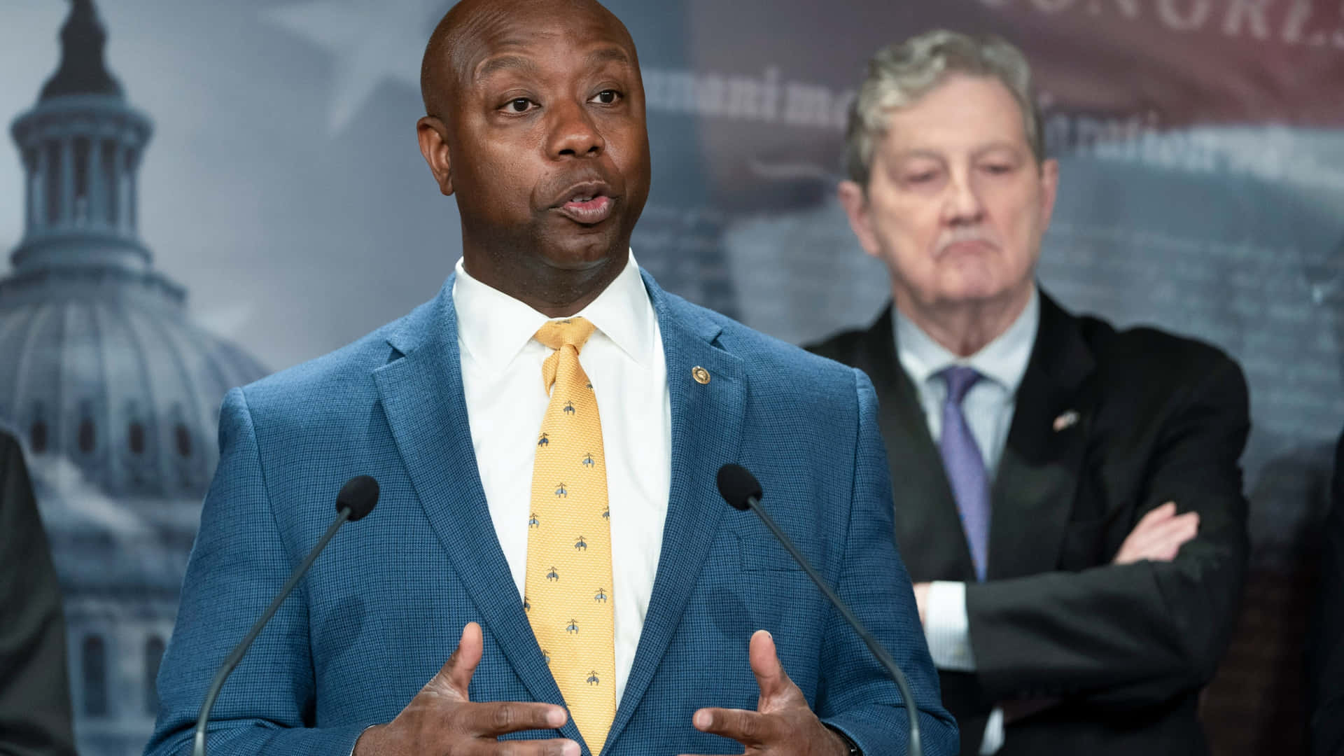 U.s Senator Tim Scott Wearing A Yellow Necktie Background