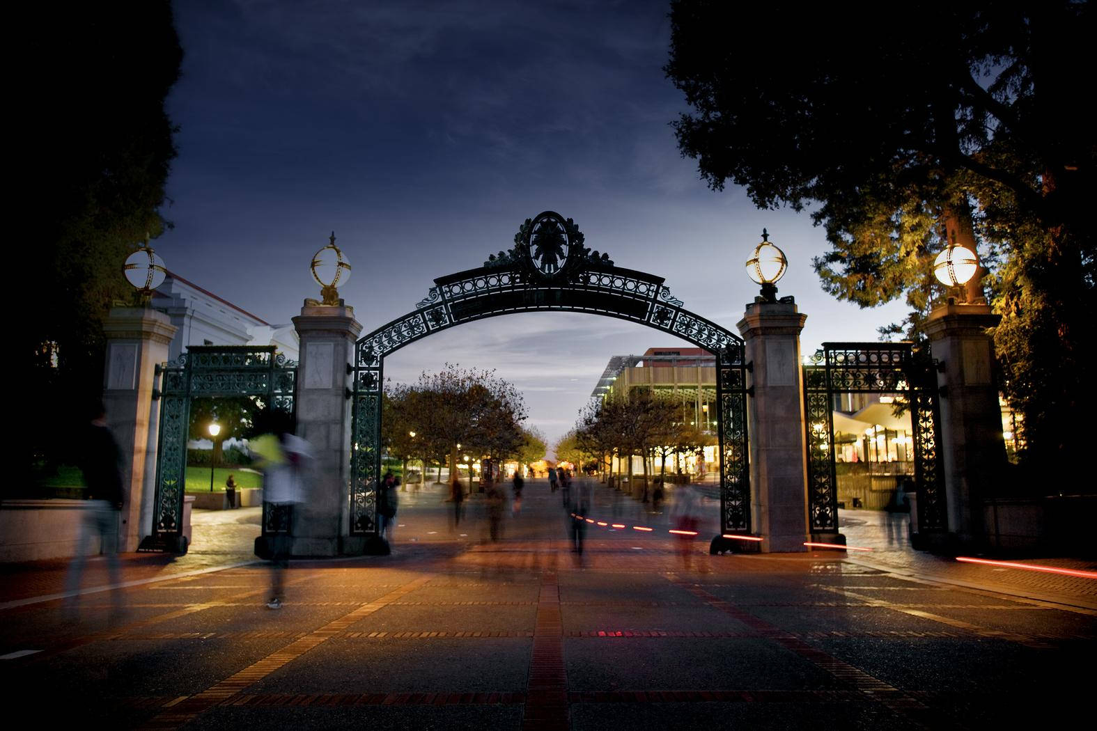 Ucb Sather Gate At Night Background