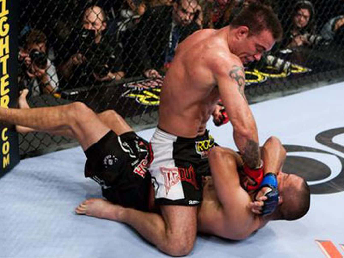 Ufc Athletes Jake Shields And Georges St-pierre In The Ring At Ufc 129