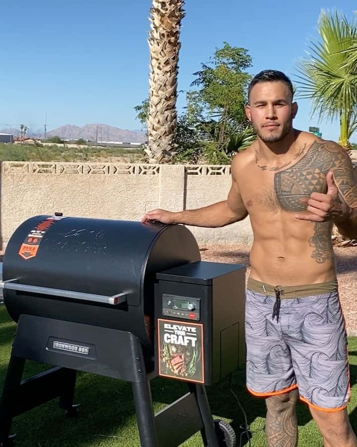 Ufc Fighter Brad Tavares Beside The Grill