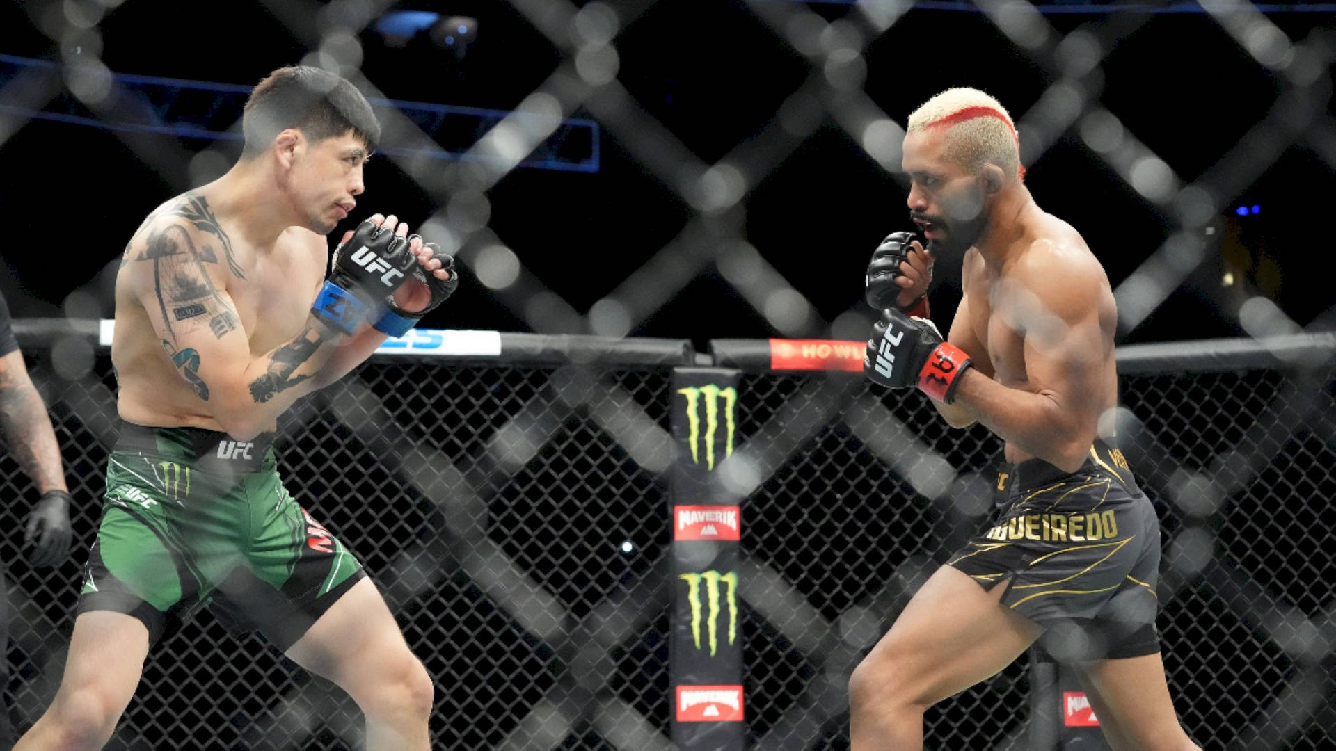 Ufc Fighter Deiveson Figueiredo In Action Against Brandon Moreno Background