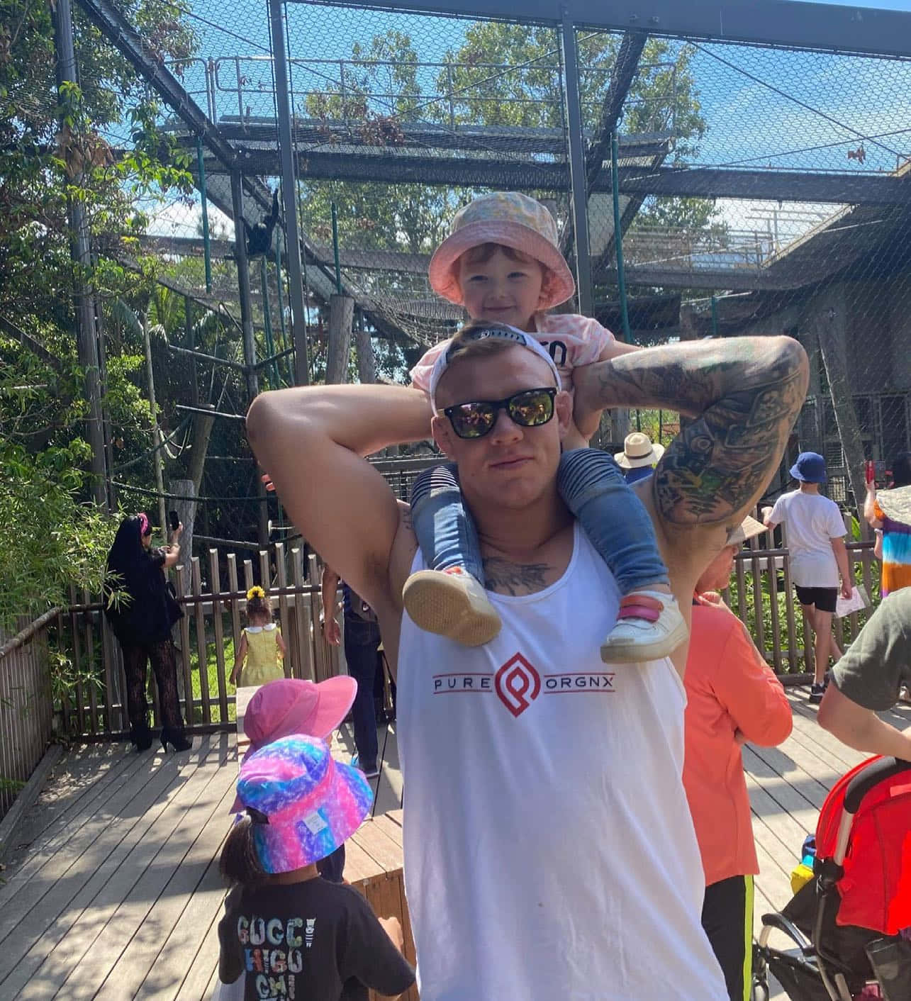 Ufc Fighter Jimmy Crute Carrying A Child On His Shoulders Background