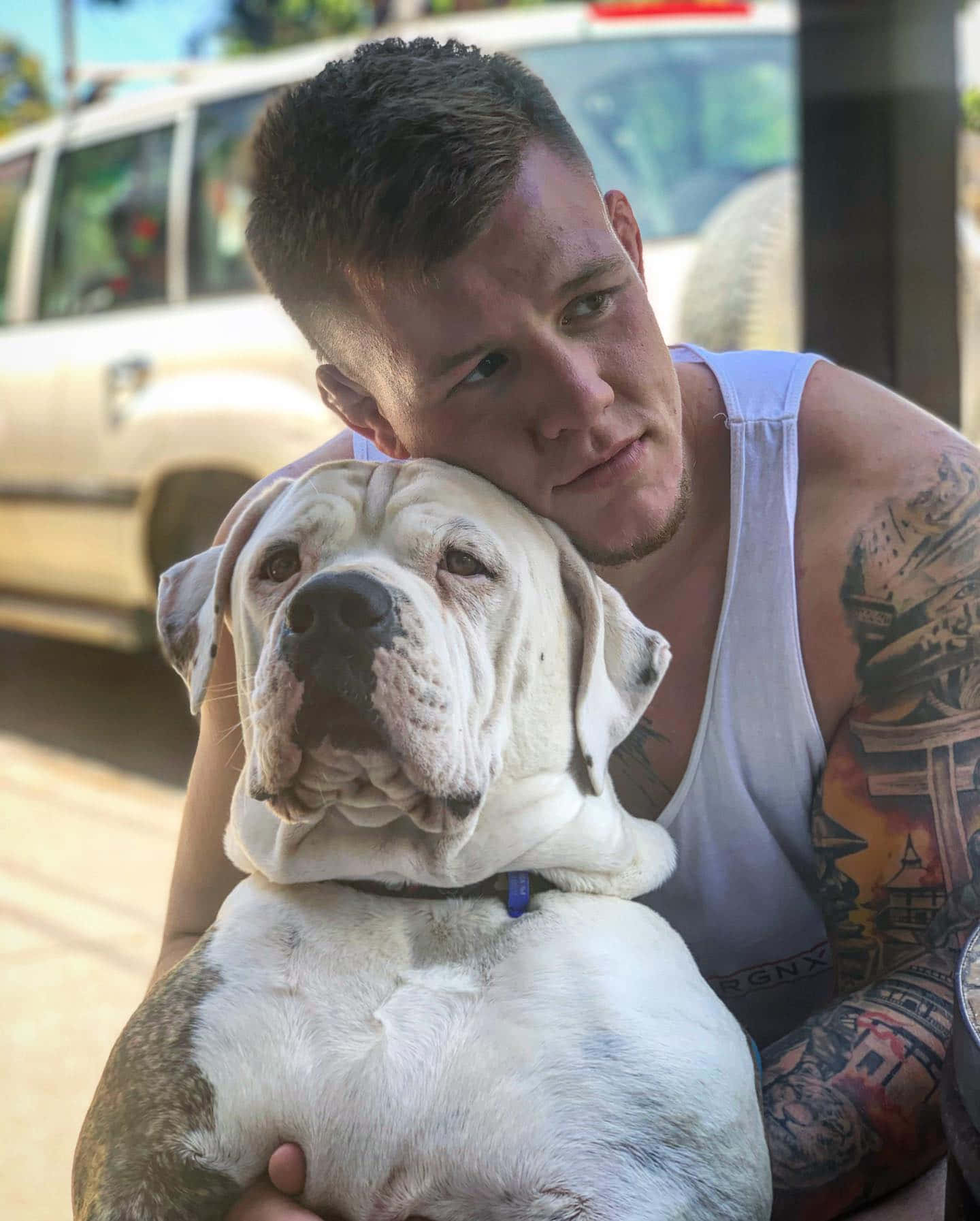 Ufc Fighter Jimmy Crute Hugging His Dog Background