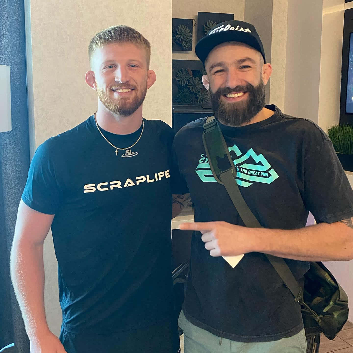 Ufc Fighter Michael Chiesa Posing With Bo Nickal Before A Fight Background