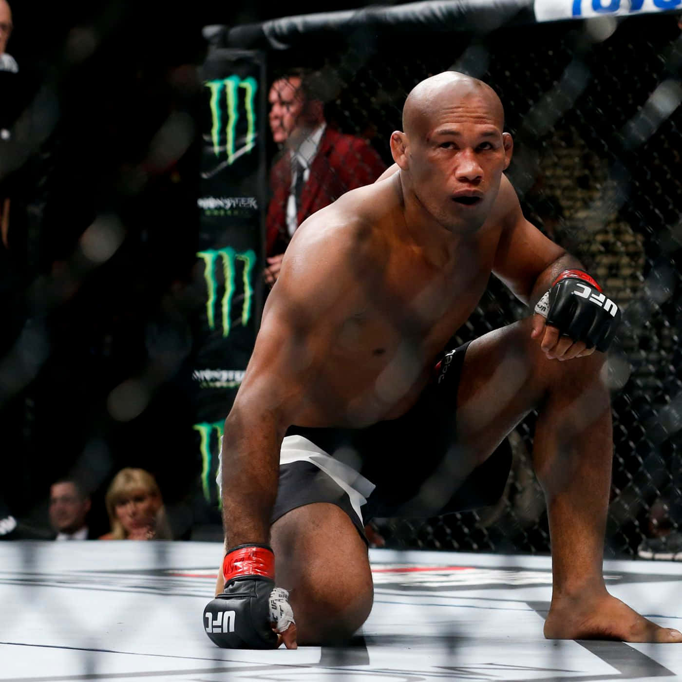 Ufc Fighter Ronaldo Souza Kneeling Background