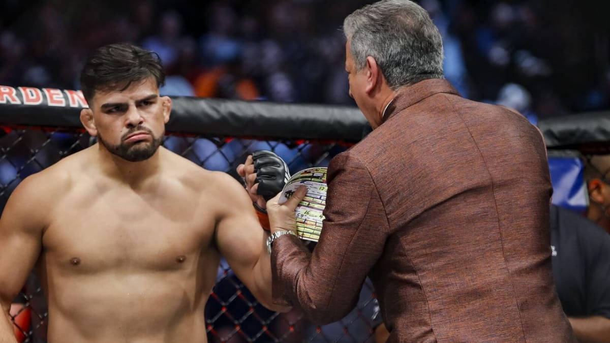 Ufc Star Kelvin Gastelum In Action Background