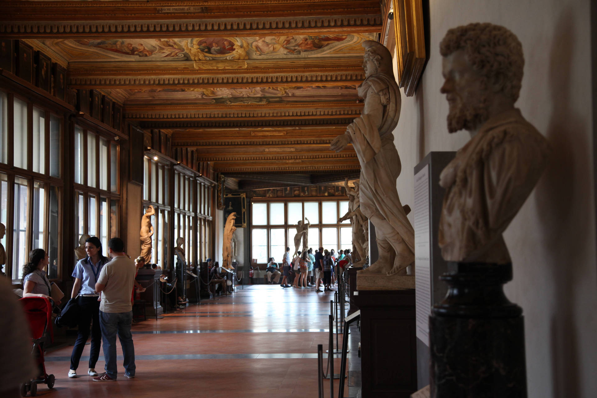 Uffizi Gallery Corridor With Tourists Background