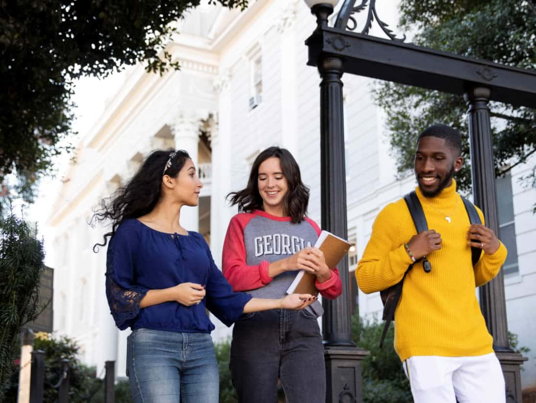 Uga Students At Renowned Arch In The University Of Georgia Background
