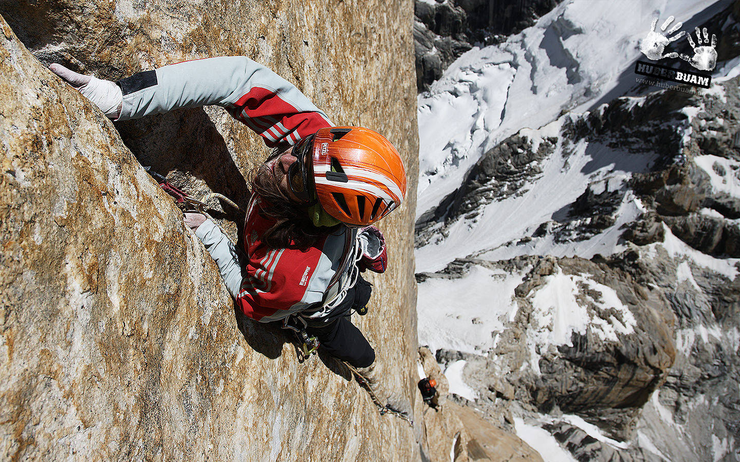 Ultimate Adventure: Man Rock Climbing Background