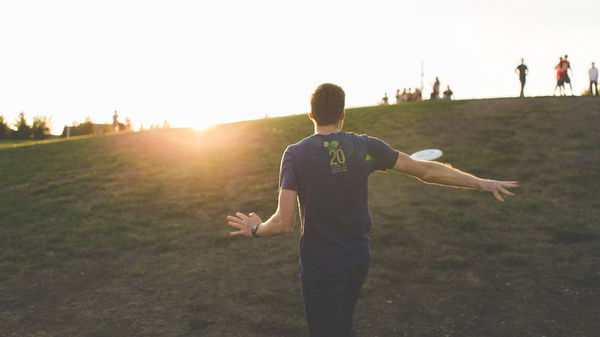 Ultimate Frisbee In A Hill Background