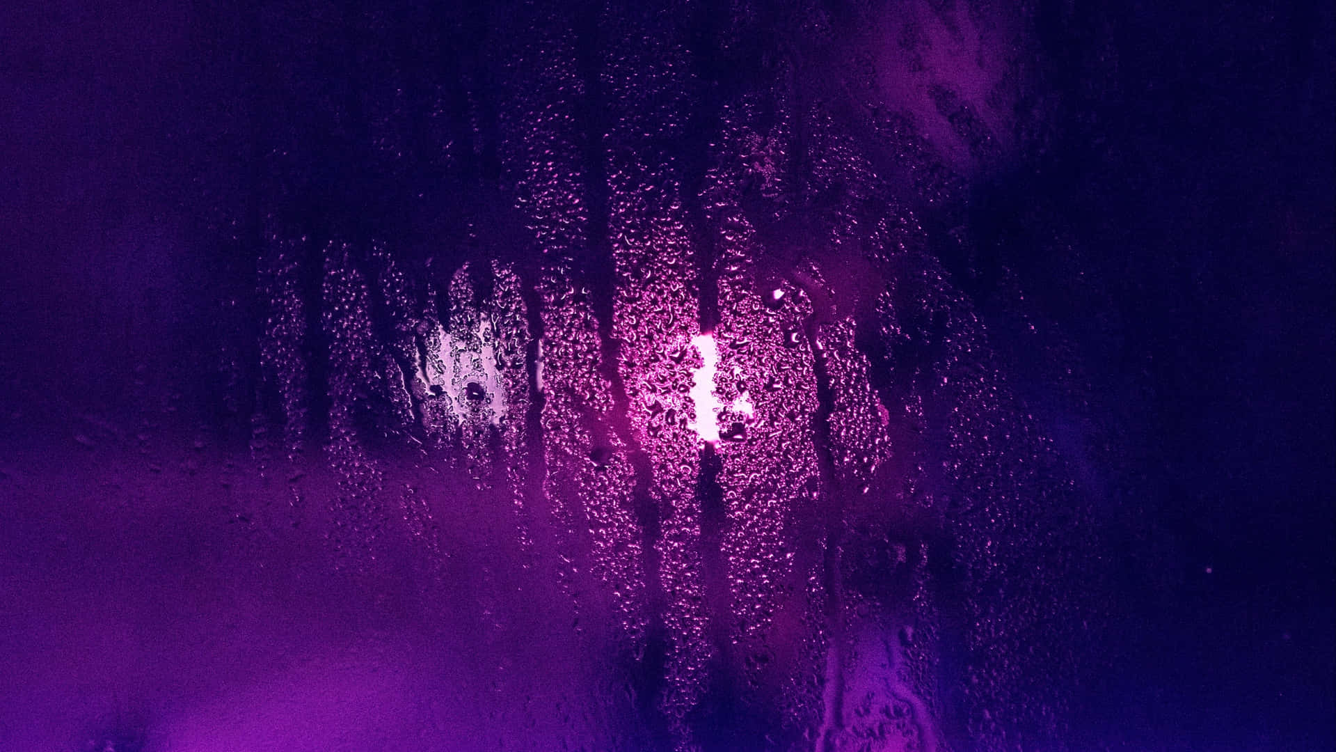 Ultraviolet Lights Against A Moist Glass Background