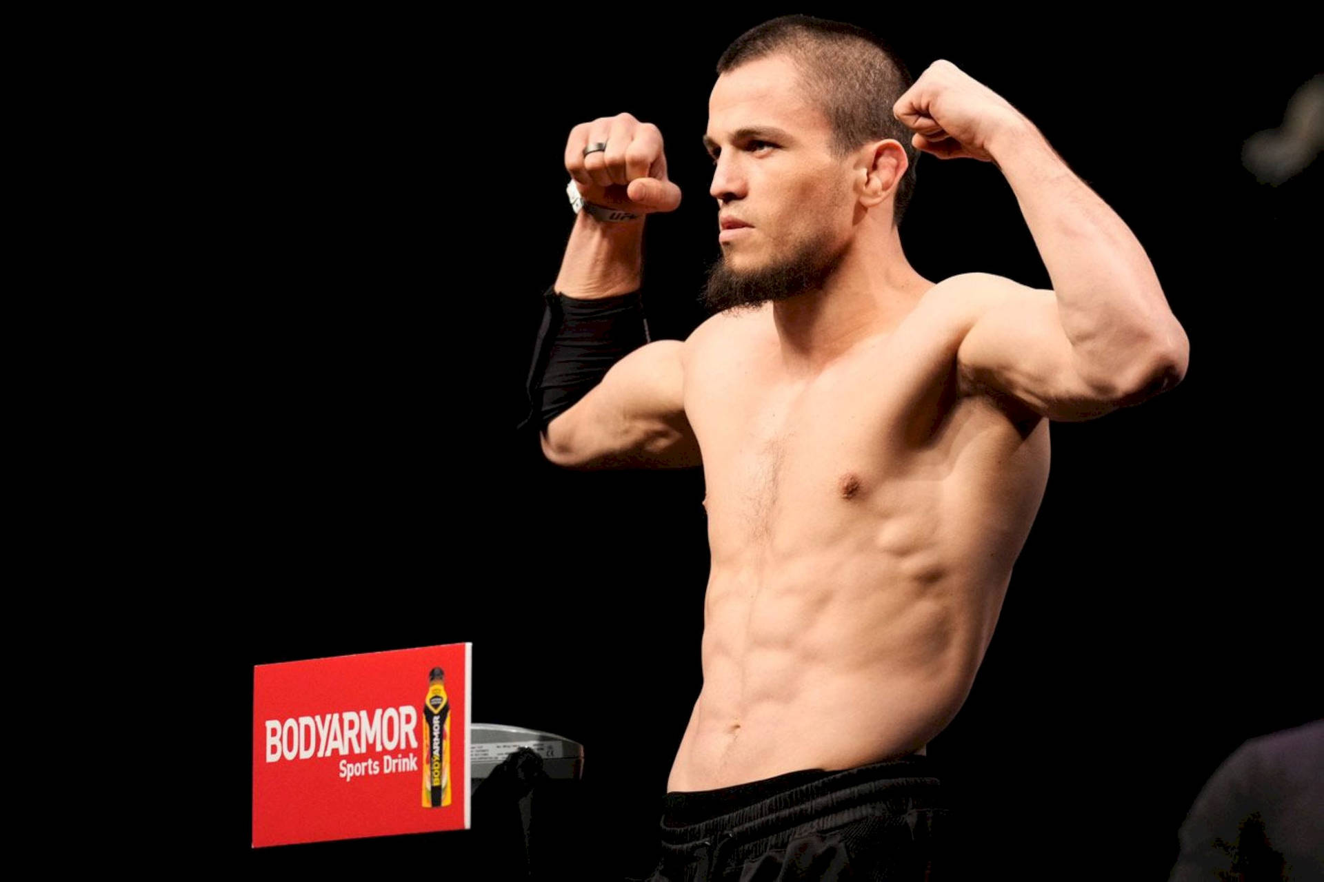 Umar Nurmagomedov Flexing His Muscles Background