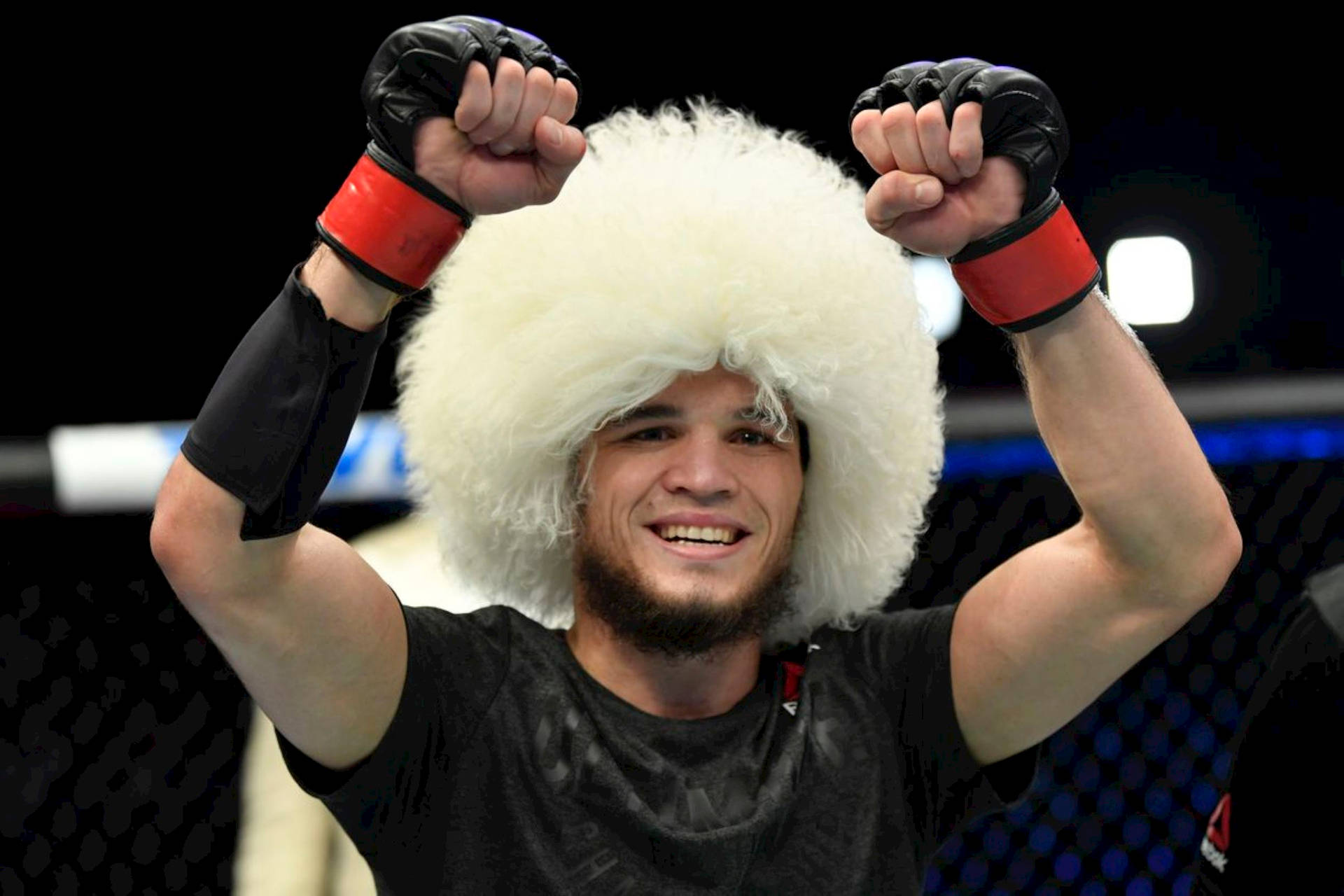 Umar Nurmagomedov Smiling Triumphantly Background