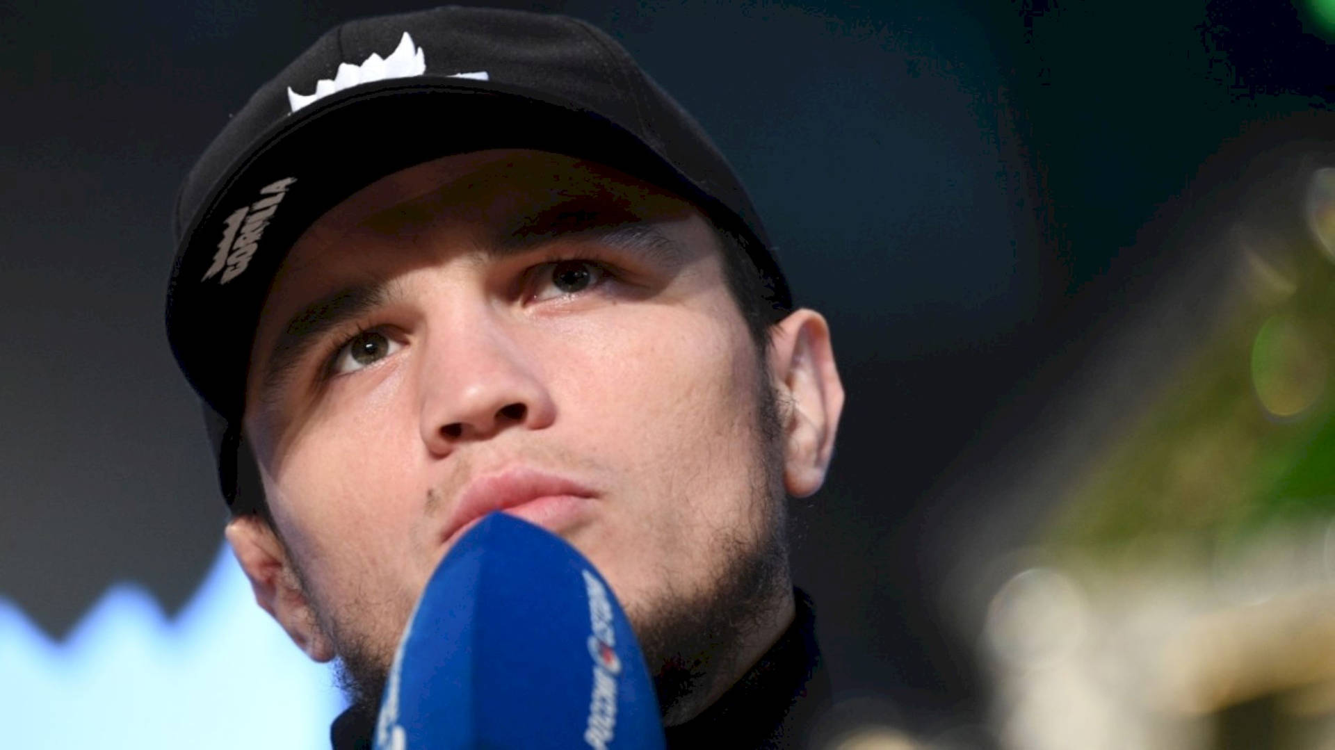 Umar Nurmagomedov Wearing A Black Cap Background