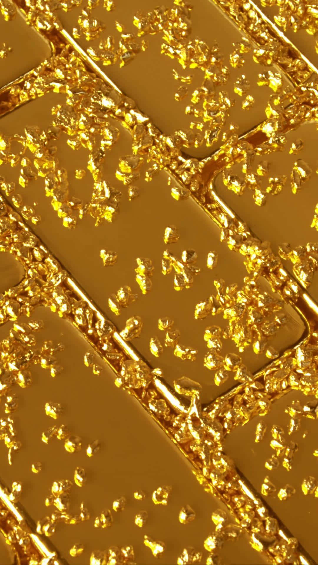 Unbox A Stunning Gold Iphone And Keep The Gold-themed Glamour Going. Background