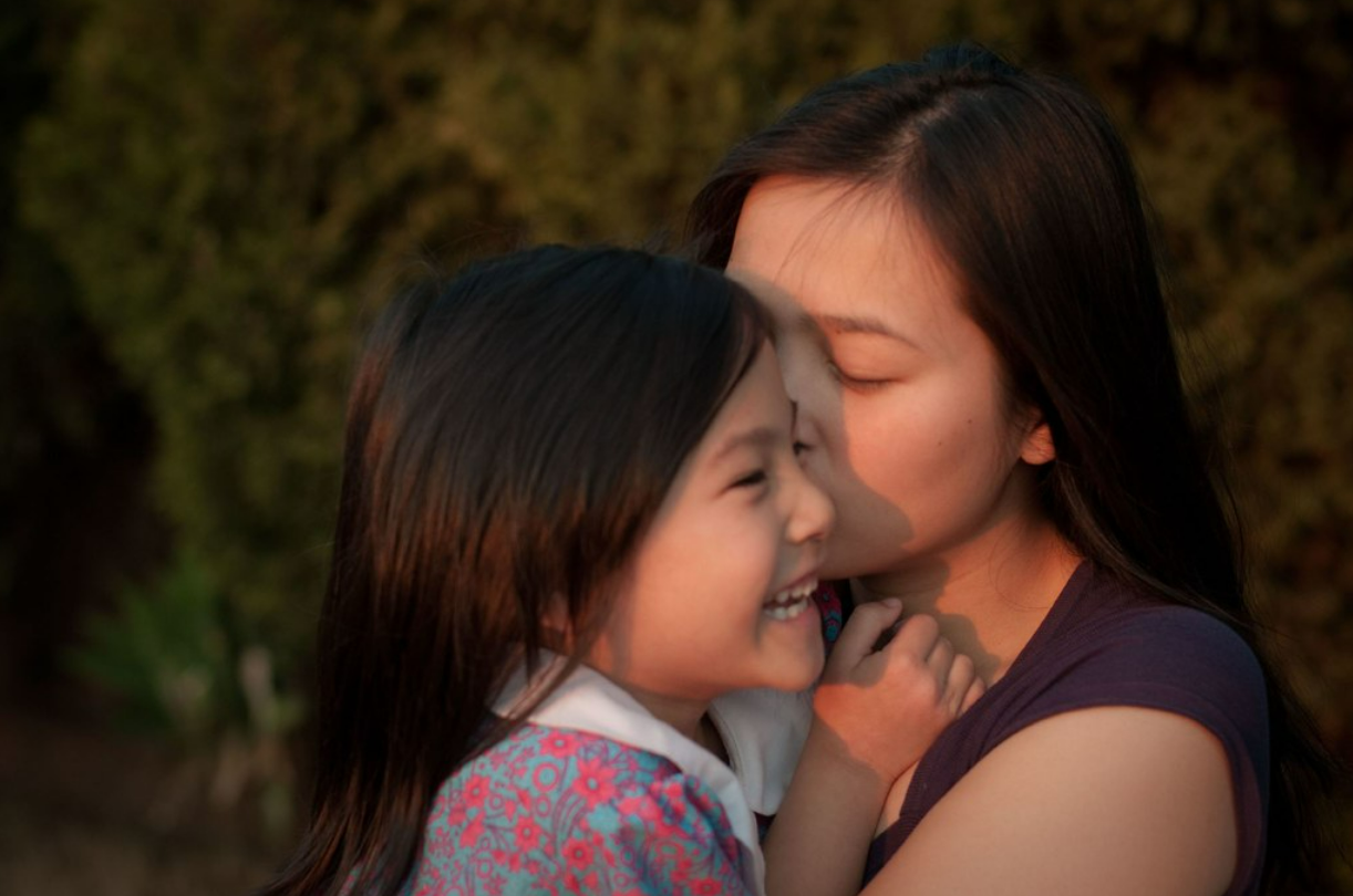 Unbreakable Bond: Mother And Daughter's Reciprocal Love Background
