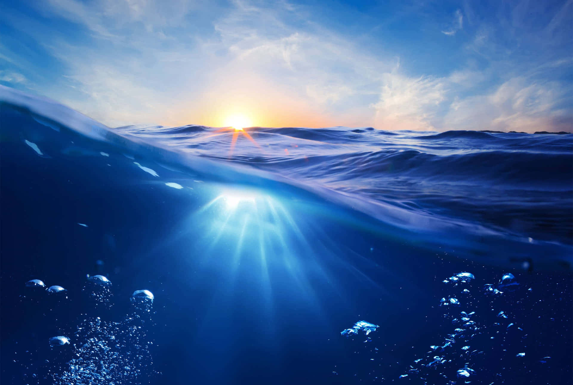 Underwater Ocean With Sun Rising Over The Water Background