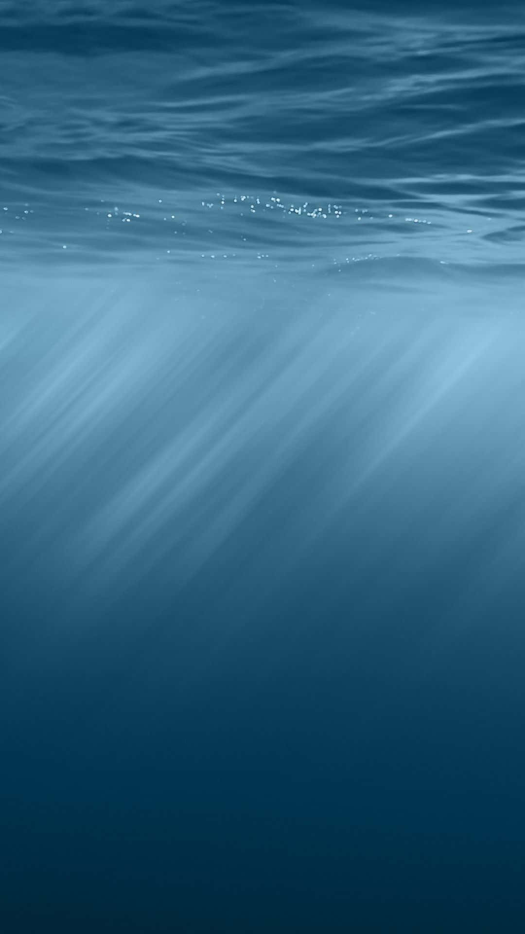Underwater Sunlight Rays Blue Ocean Background Background