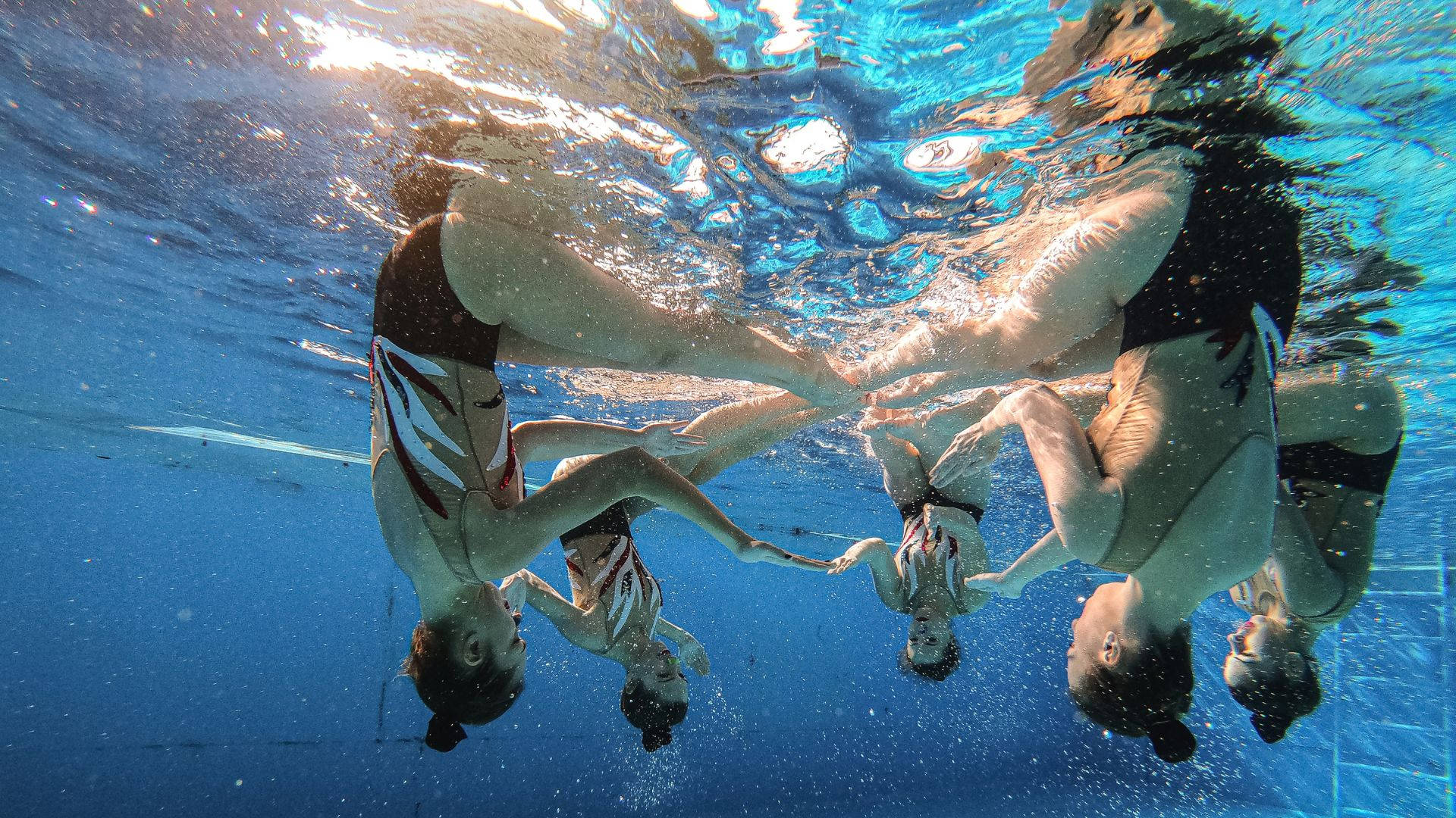 Underwater Upside Down Artistic Swimming Background