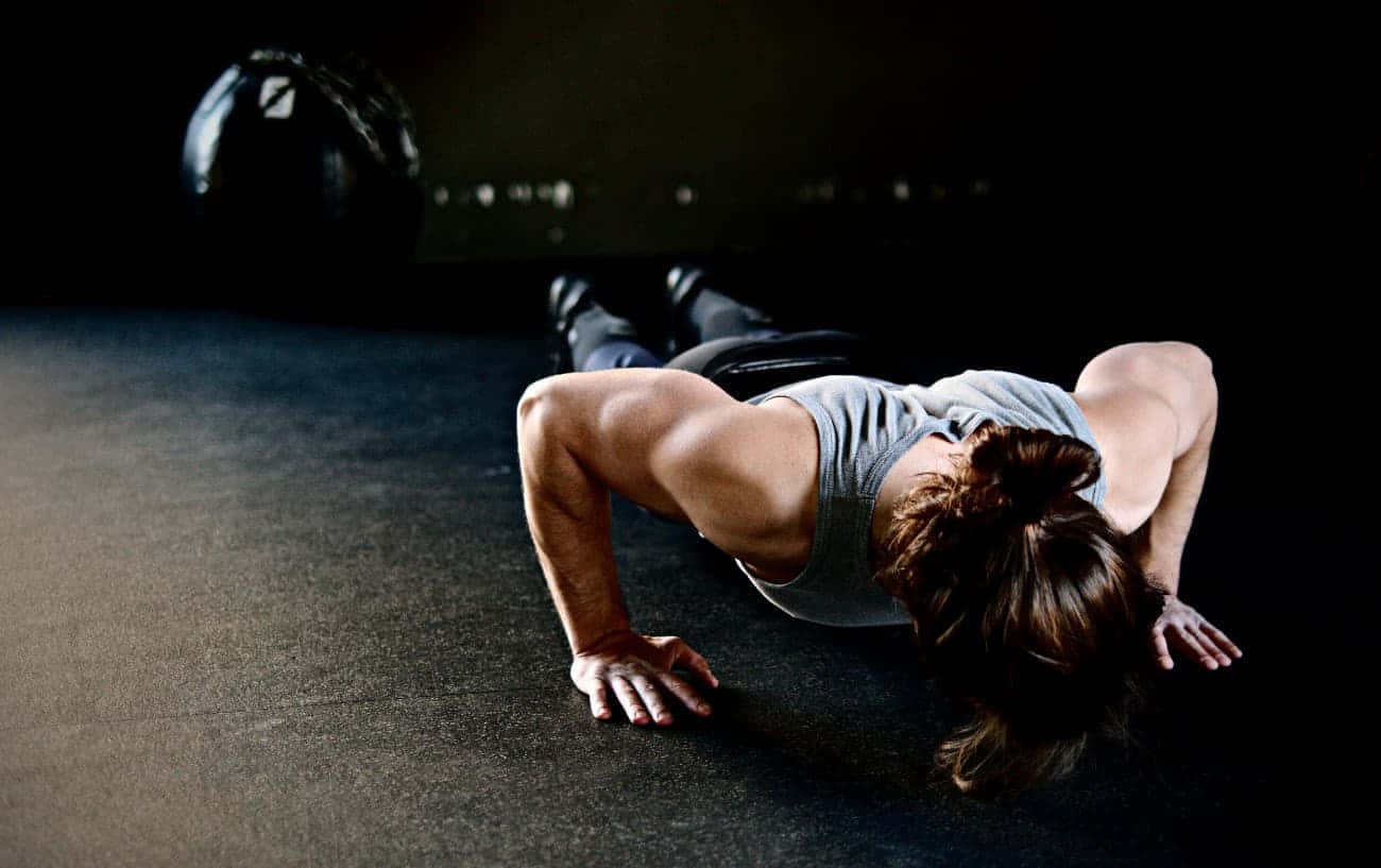Unilateral Exercise In A Dark Room Background
